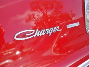 Silver charger symbol on a red Dodge Charger. - 495 Chrysler Jeep Dodge Ram