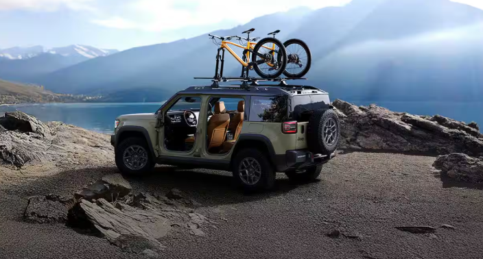 2026 Jeep Recon electric SUV with bike rack and open doors near the mountains from 495 Chrysler Jeep Dodge RAM