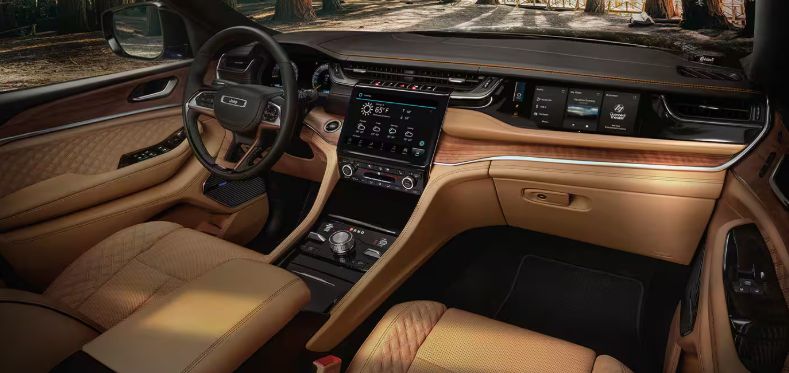2026 Jeep Grand Cherokee 4xe interior with tan leather and touchscreen dash