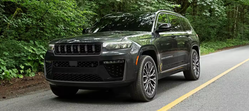 Bloack 2026 Jeep Grand Cherokee 4xe on highway.